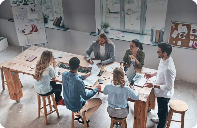 Team meeting around a conference table, with a live occupancy report overlaid