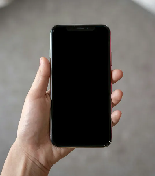 A hand holding a phone showing the Cohesion app credential screen