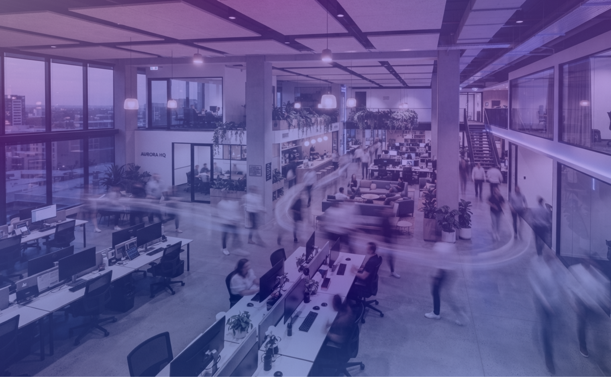 Time-lapse of a busy modern workplace showing people moving through the office